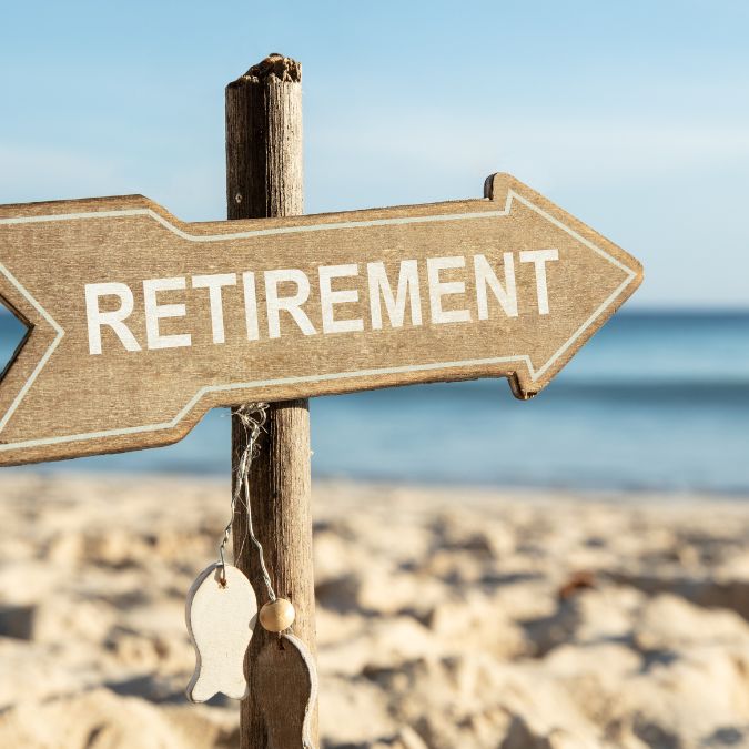 retirement sign to the beach
