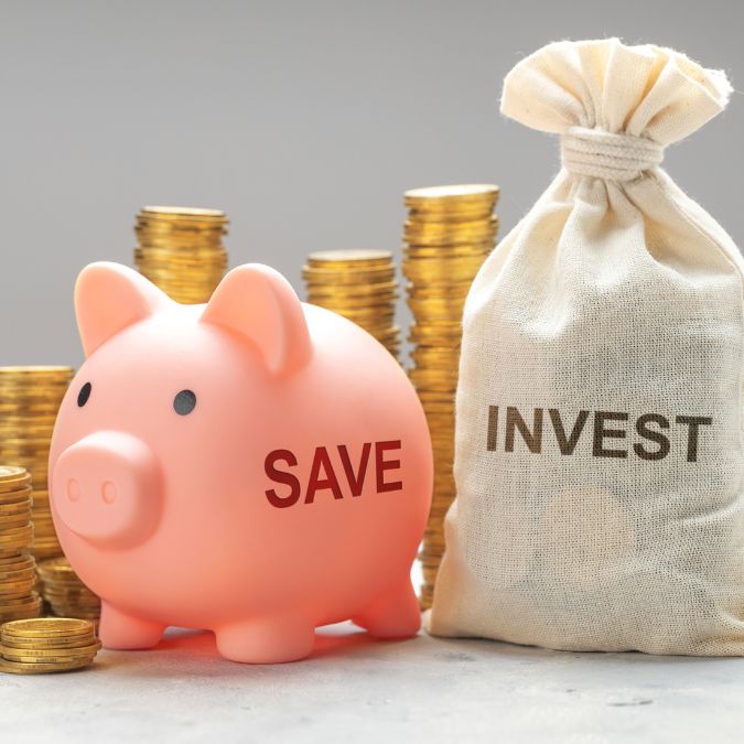 save and invest piggy bank money bag and coins